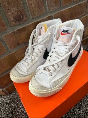 Nike White High-Top Sneakers with Black Swoosh and Cream Accents